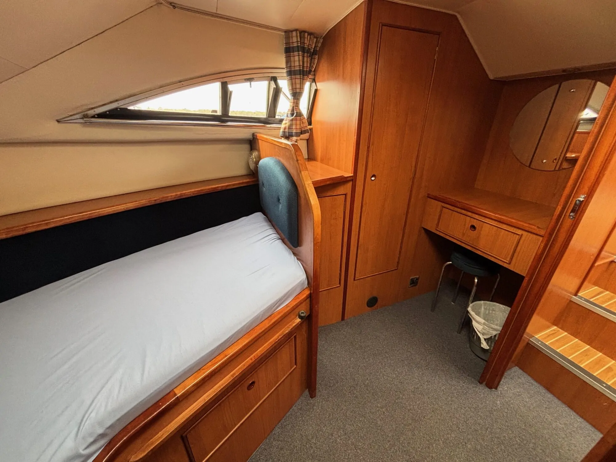 Front cabin in the Noble Chief showing V-berth and dressing table